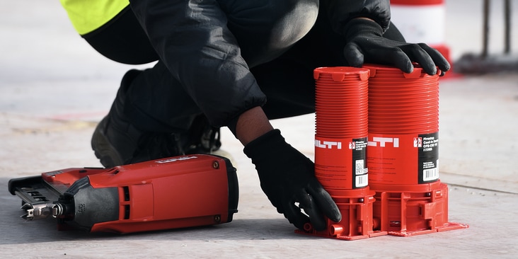 Hilti firestop cast-in sleeves for cables and pipes being placed on concrete slabs after laying them out in BIM