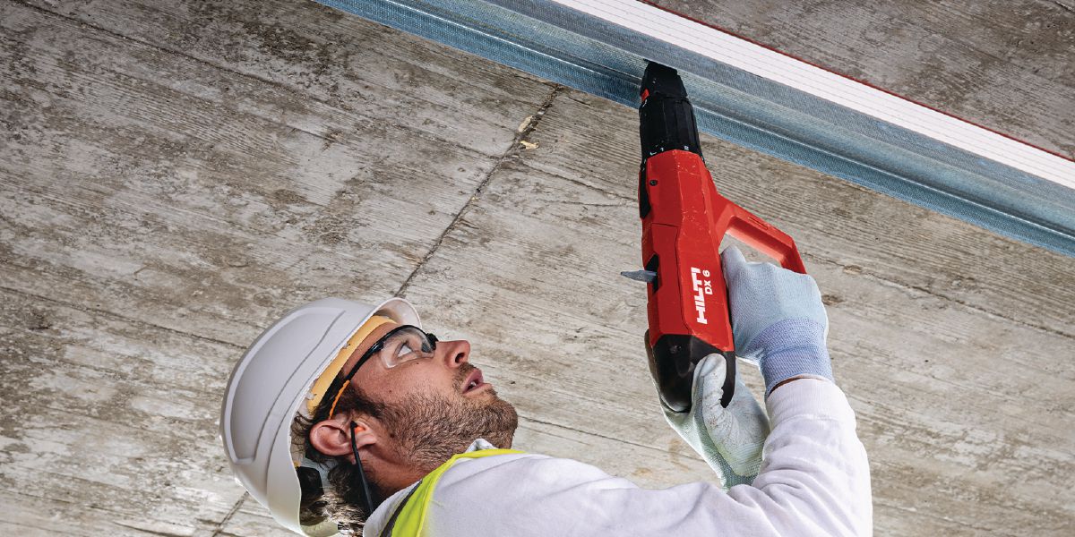 Installing deflection head with powder-actuated tool DX 6