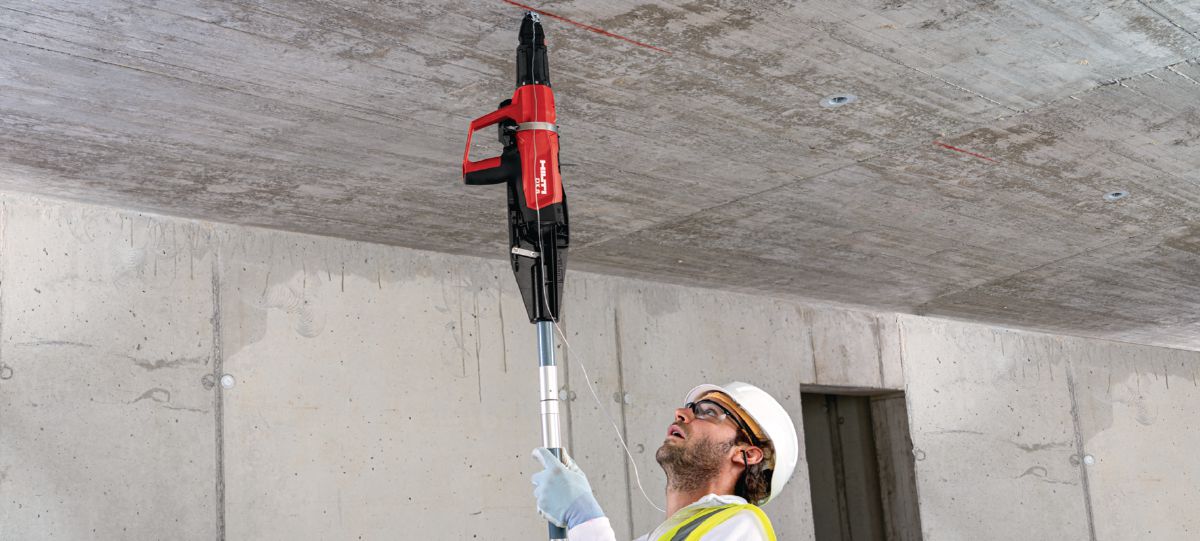 Installing ceiling clip with powder-actuated tool DX 6-F8 pole tool