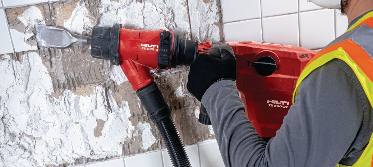Removing tiles with SDS-Max cordless wall breaker TE 500-22 and dust removal system