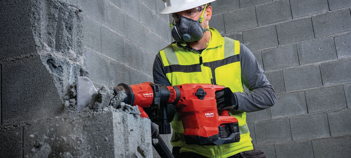 Masonry   wall breaking with SDS-Max cordless wall breaker TE 500-22 and dust removal   system