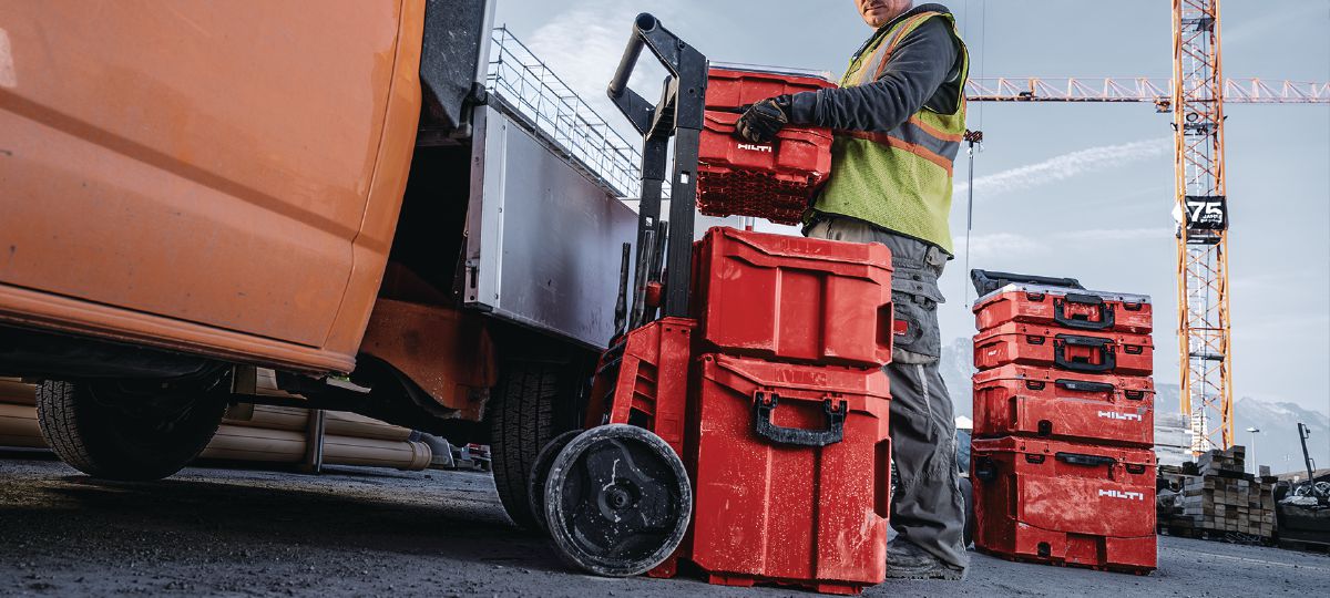 Cropped application picture of man unloading Prokit from van