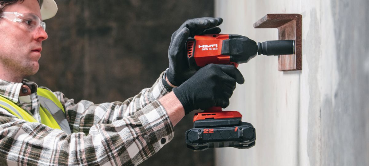 Kwik-X - driving in the screw anchor using a SIW 6-22 in a ledger angle application. (US hard hat), cropped version