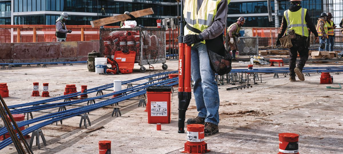 Cropped application image of Construction worker installing KCCM WF anchor onto wood formwork using the Kwik Cast setting tool. KCM-WF-ST. Dallas, TX. 2024.